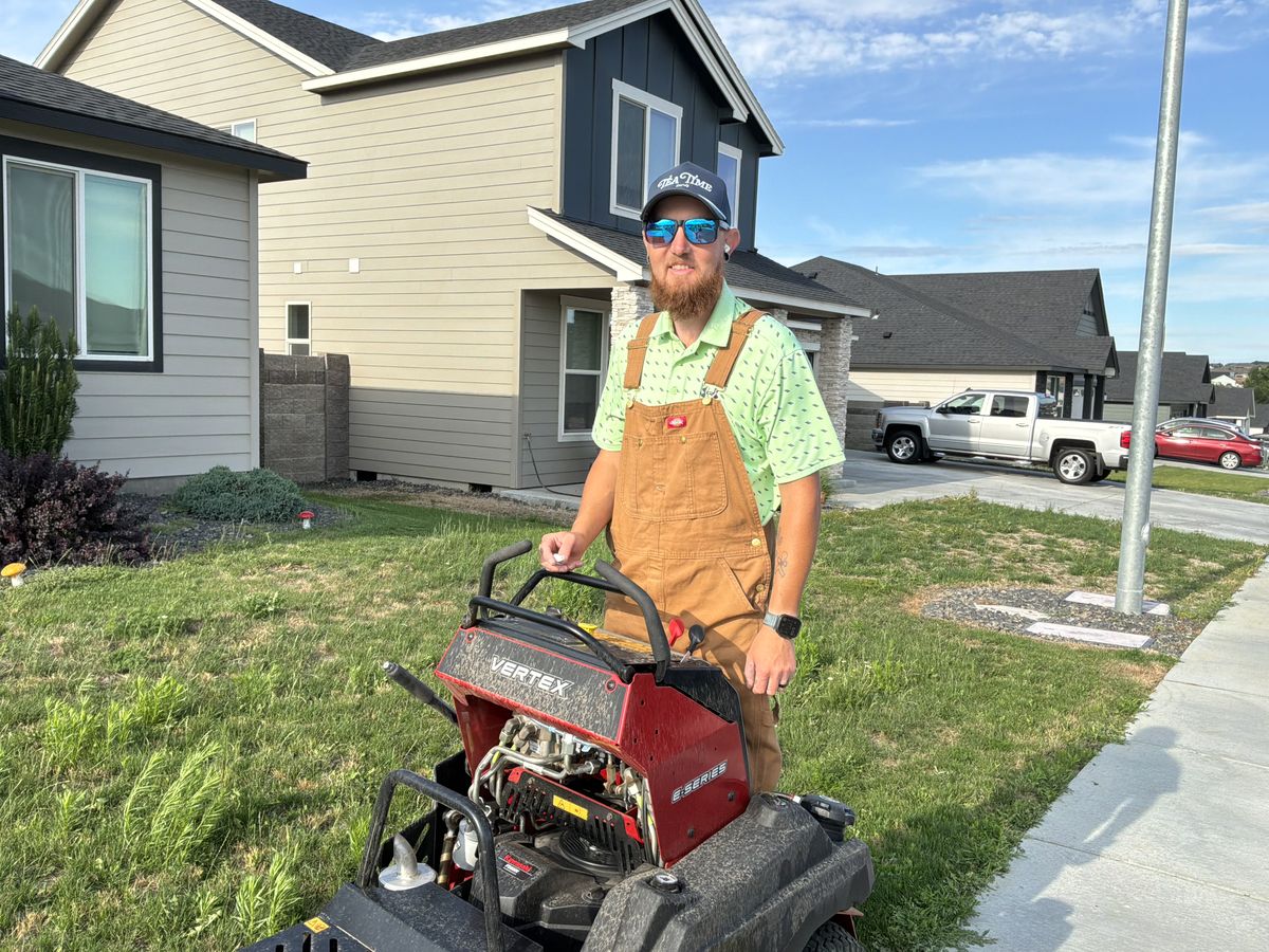 Tanner with his equipment on a job site